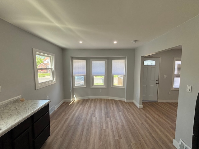 11414 Abington Ave, Detroit, MI 48227 - unfurnished living room with light wood-style floors, recessed lighting, and baseboards
