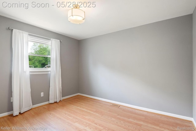 40755 Judd Rd, Belleville, MI 48111 - spare room featuring wood finished floors and baseboards