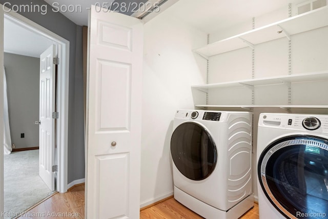 40755 Judd Rd, Belleville, MI 48111 - laundry room featuring washer and dryer, light wood-style floors, and baseboards