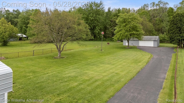 40755 Judd Rd, Belleville, MI 48111 - view of yard with an outdoor structure and a detached garage