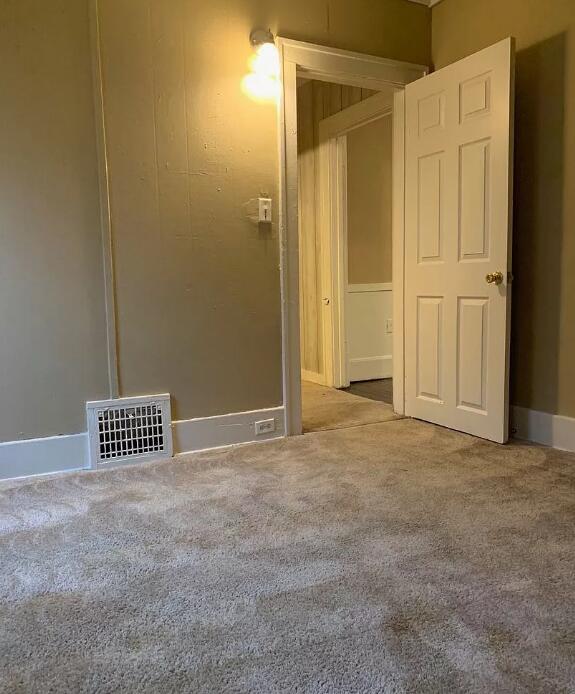 39 Iona Ave, Muskegon, MI 49442 - spare room with carpet and baseboards