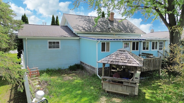 rear view of property with a chimney