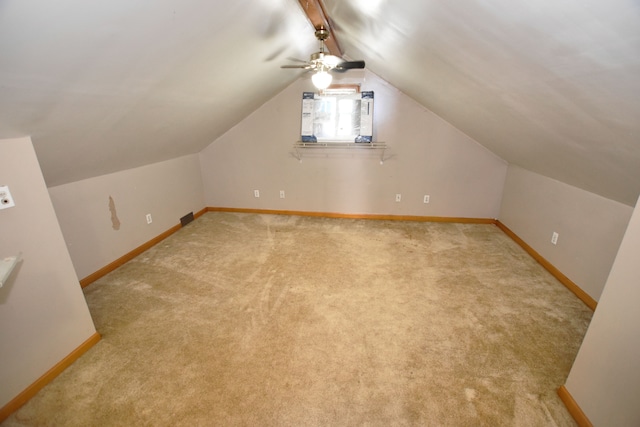 bonus room featuring light carpet, vaulted ceiling, baseboards, and ceiling fan