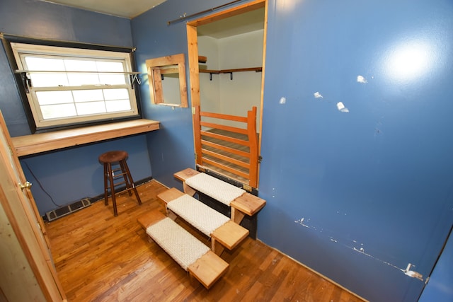 staircase with wood finished floors