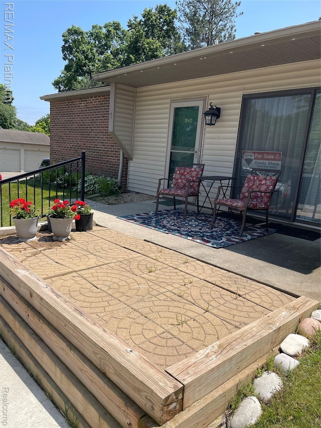 360 Spring Brooke Dr Unit 31, Brighton, MI 48116 - deck with a patio area