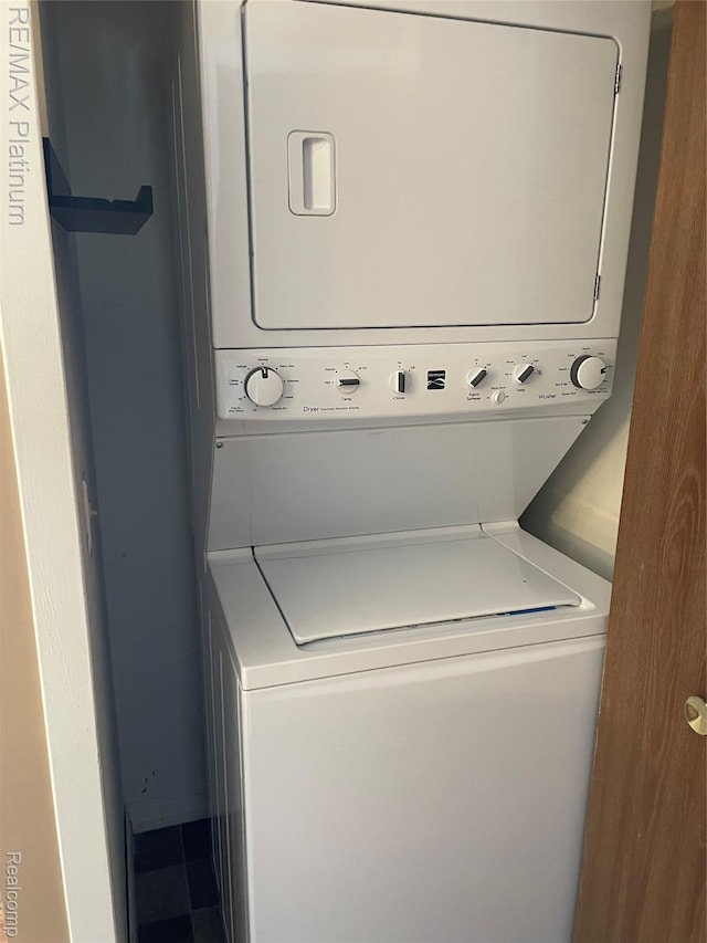 360 Spring Brooke Dr Unit 31, Brighton, MI 48116 - laundry area featuring estacked washer and dryer