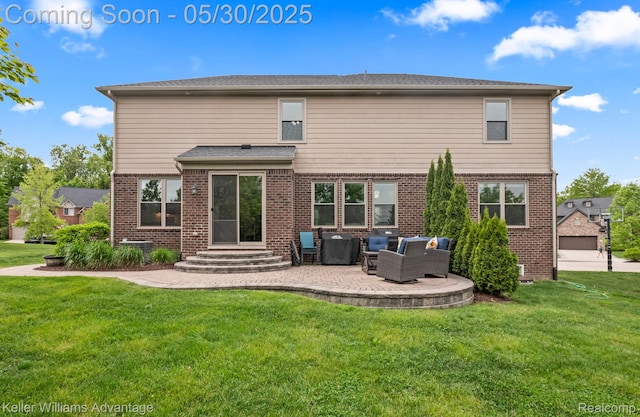 41740 Steinbeck Gln, Novi, MI 48377 - back of property with brick siding, a yard, a patio, and an outdoor living space