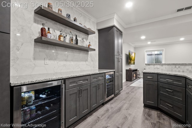 41740 Steinbeck Gln, Novi, MI 48377 - kitchen with wine cooler, crown molding, open shelves, light stone countertops, and tasteful backsplash