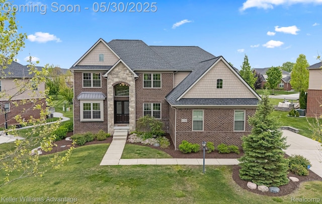 41740 Steinbeck Gln, Novi, MI 48377 - view of front of property with a front yard and brick siding
