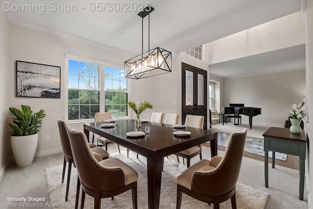 41740 Steinbeck Gln, Novi, MI 48377 - dining space featuring baseboards, a chandelier, and light colored carpet
