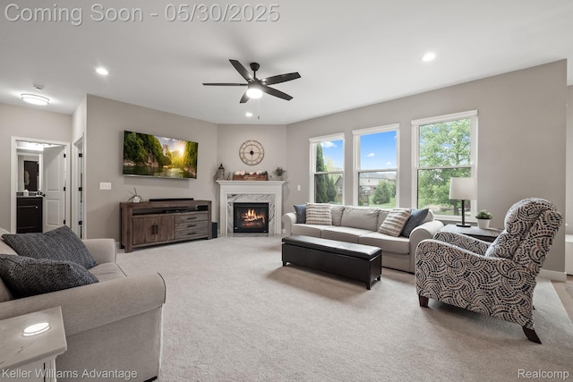 41740 Steinbeck Gln, Novi, MI 48377 - living room with carpet flooring, recessed lighting, ceiling fan, and a high end fireplace