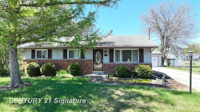 3455 Angel Dr, Saginaw, MI 48601 - view of front facade with brick siding, a front yard, and a garage