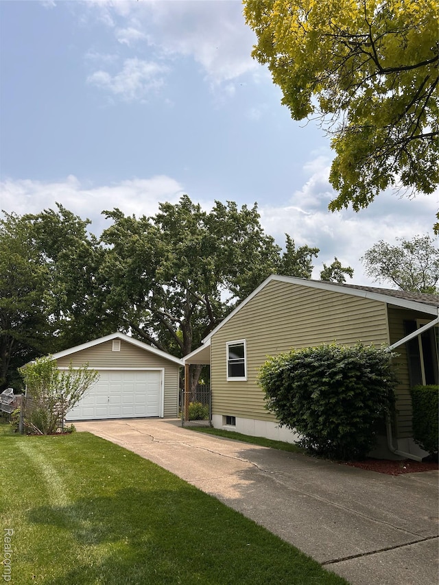 809 Isbell St, Howell, MI 48843 - view of front of house with an outbuilding, a garage, and a front lawn