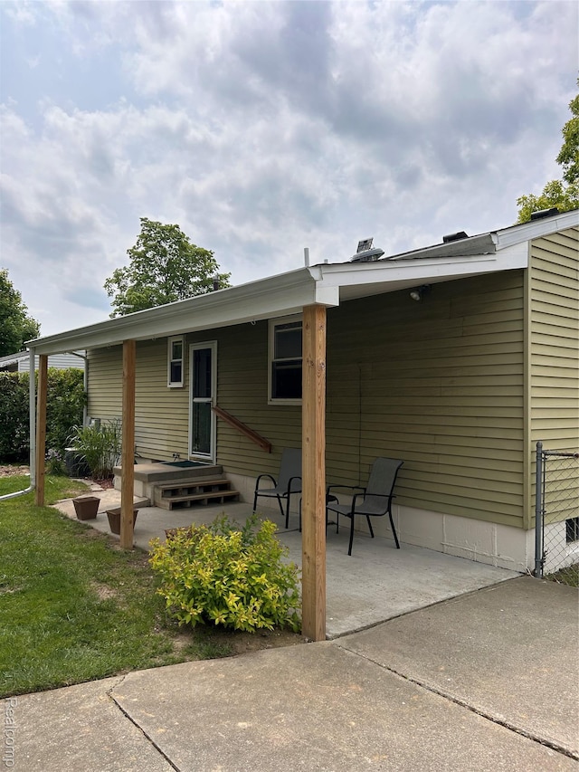 809 Isbell St, Howell, MI 48843 - rear view of house featuring a patio area