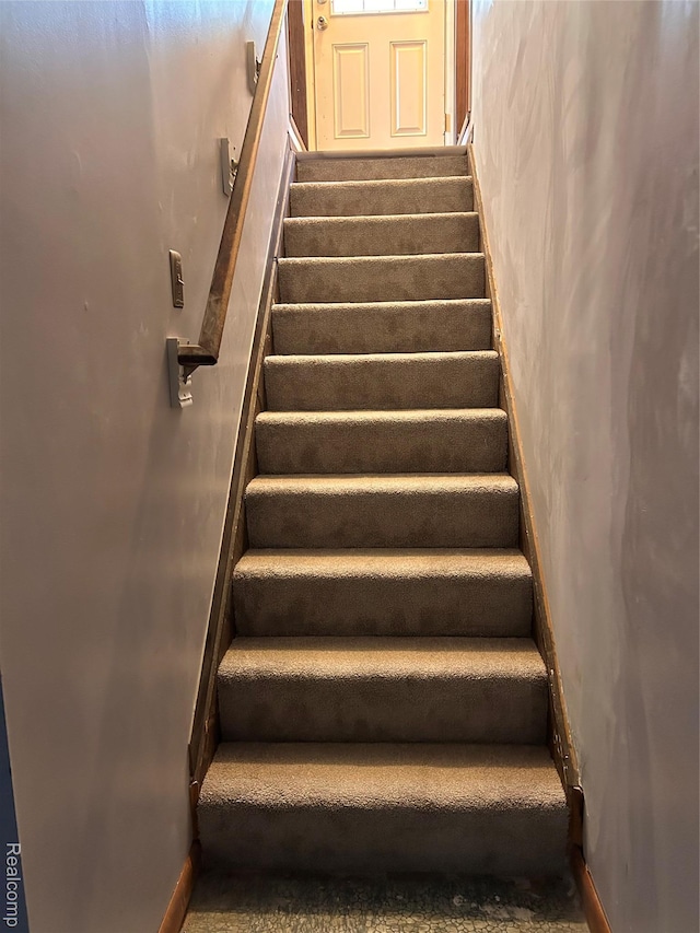 809 Isbell St, Howell, MI 48843 - staircase with carpet and baseboards