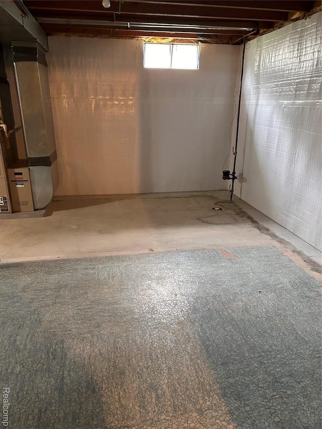 809 Isbell St, Howell, MI 48843 - basement with heating unit