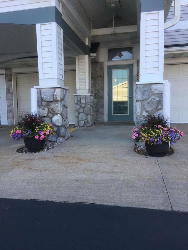 300 S Rath Ave Unit 1, Ludington, MI 49431 - doorway to property featuring stone siding