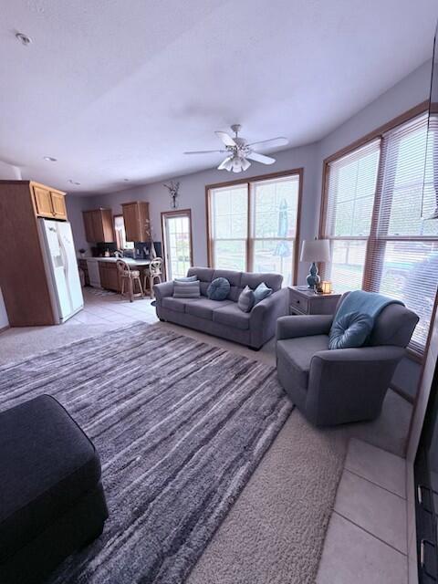 300 S Rath Ave Unit 1, Ludington, MI 49431 - living room featuring light tile patterned floors and ceiling fan