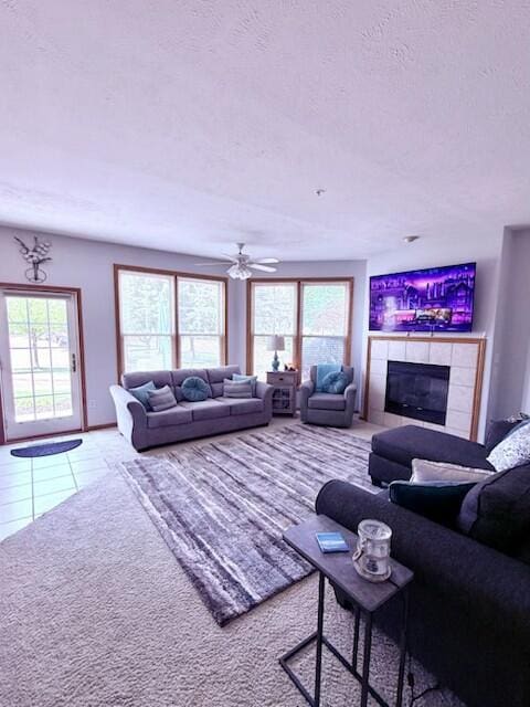 300 S Rath Ave Unit 1, Ludington, MI 49431 - carpeted living area with a fireplace, a textured ceiling, and tile patterned flooring