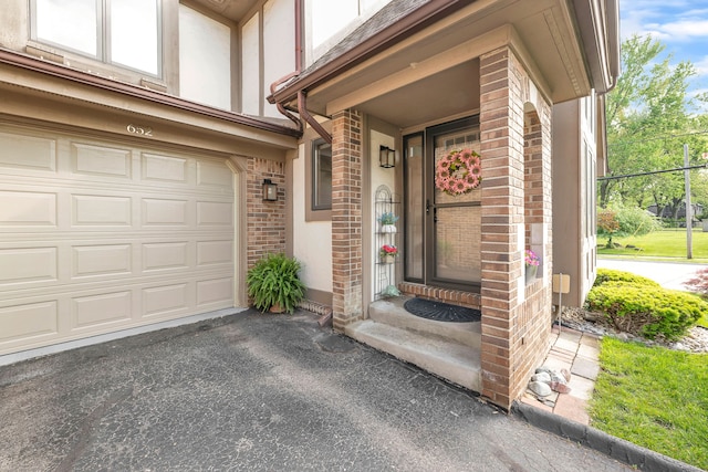 652 S Military St, Dearborn, MI 48124 - property entrance with brick siding, asphalt driveway, and stucco siding