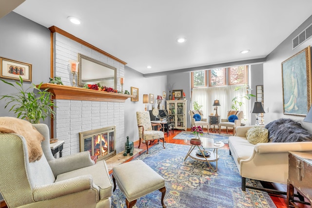 652 S Military St, Dearborn, MI 48124 - living area featuring a brick fireplace, wood finished floors, recessed lighting, and ornamental molding