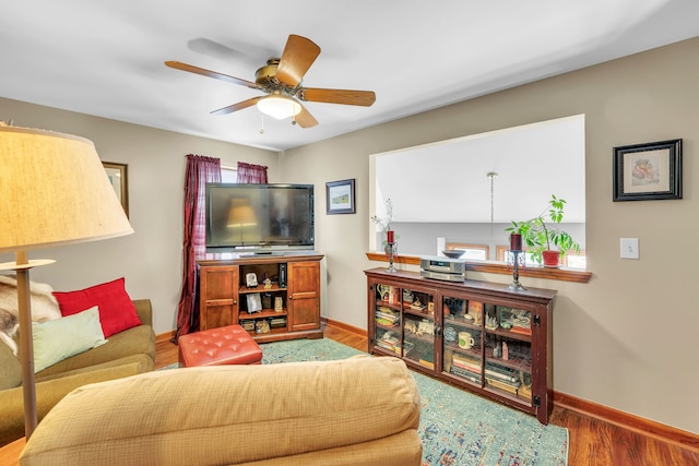 652 S Military St, Dearborn, MI 48124 - living area with wood finished floors, ceiling fan, and baseboards