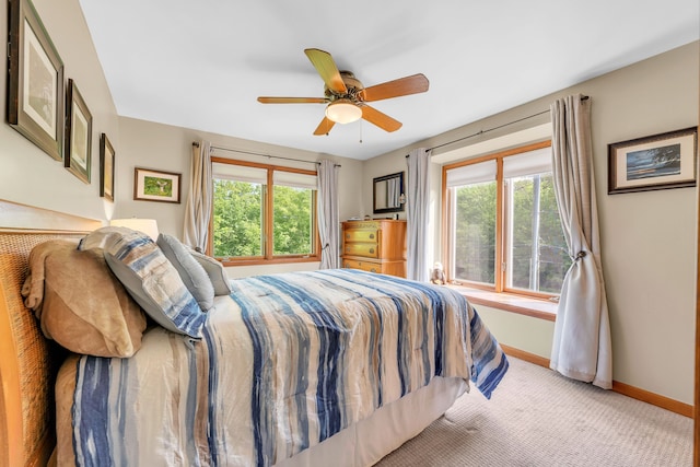 652 S Military St, Dearborn, MI 48124 - bedroom with multiple windows, baseboards, carpet floors, and a ceiling fan
