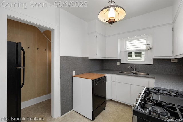 1215 Irving Ave, Royal Oak, MI 48067 - kitchen featuring black appliances, white cabinets, a sink, and dark countertops