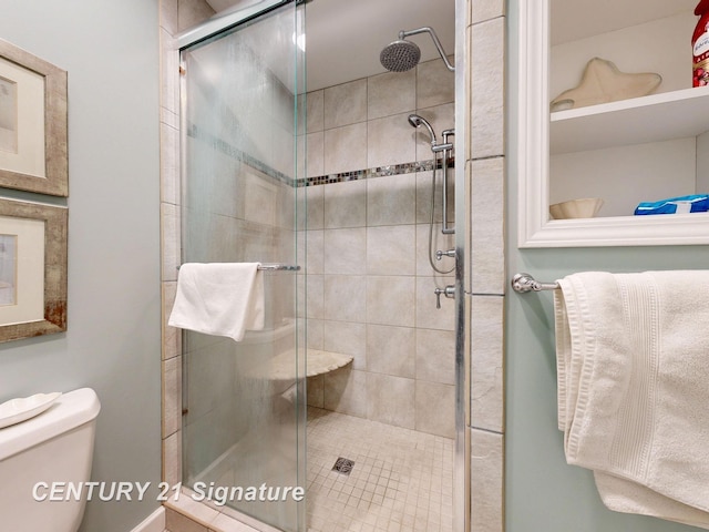 full bath featuring toilet and a shower stall