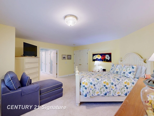 bedroom featuring carpet and baseboards