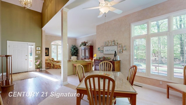 dining room featuring baseboards, a ceiling fan, and wood finished floors