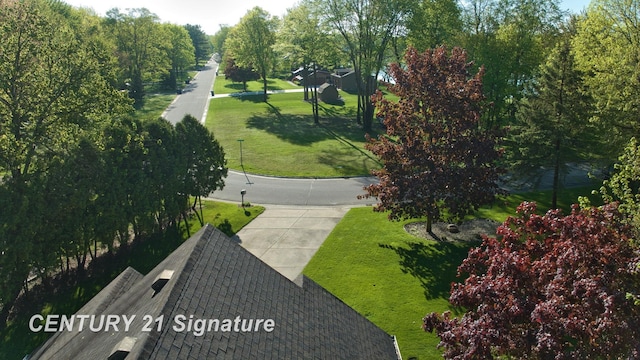 view of property's community with a yard
