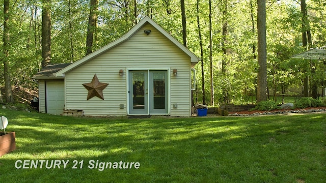 rear view of property featuring a yard