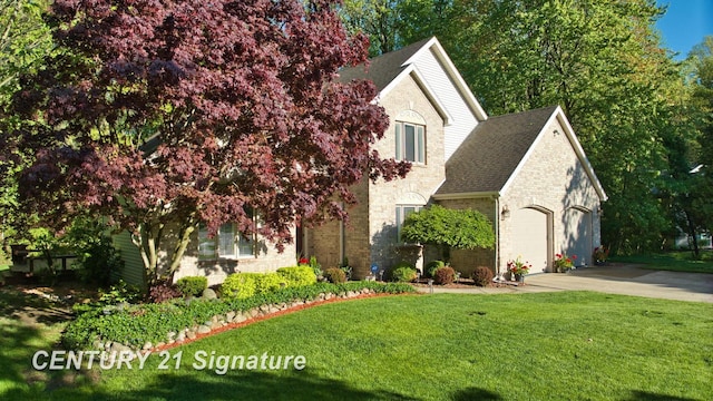 view of front of property with driveway, a front lawn, a shingled roof, an attached garage, and brick siding