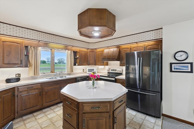 280 E Nebobish Rd, Essexville, MI 48732 - kitchen with appliances with stainless steel finishes, a sink, premium range hood, light countertops, and baseboards