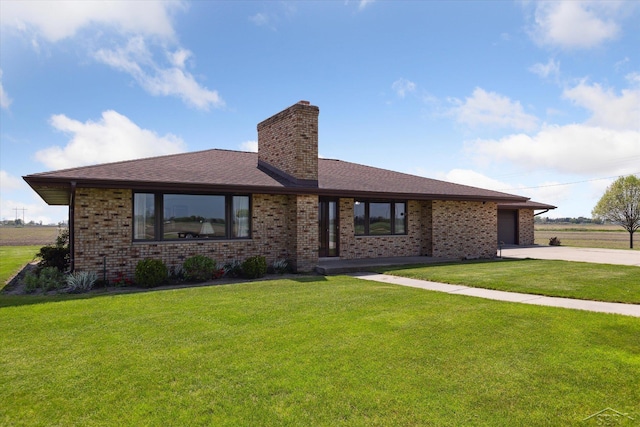 280 E Nebobish Rd, Essexville, MI 48732 - view of front facade featuring driveway, a chimney, brick siding, and a garage