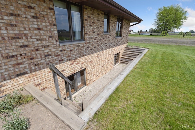 280 E Nebobish Rd, Essexville, MI 48732 - view of property exterior featuring brick siding and a yard