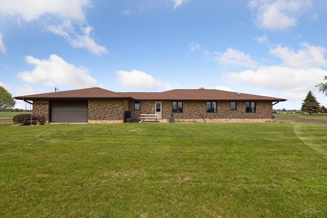 280 E Nebobish Rd, Essexville, MI 48732 - view of front facade with a garage, a front lawn, and brick siding