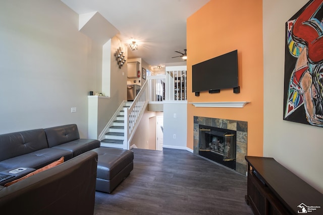 2827 Biddle Ave, Wyandotte, MI 48192 - living room with dark wood-type flooring, ceiling fan, stairs, and a fireplace