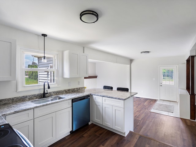 600 Los Arboles Dr, Wolverine Lake, MI 48390 - kitchen with dishwasher, a sink, a peninsula, white cabinets, and dark wood-type flooring