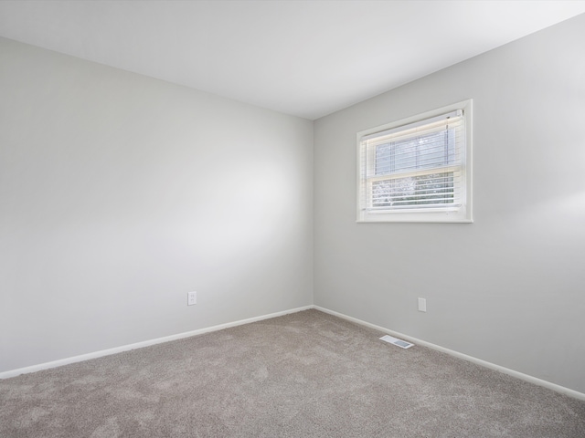 600 Los Arboles Dr, Wolverine Lake, MI 48390 - spare room with carpet floors and baseboards