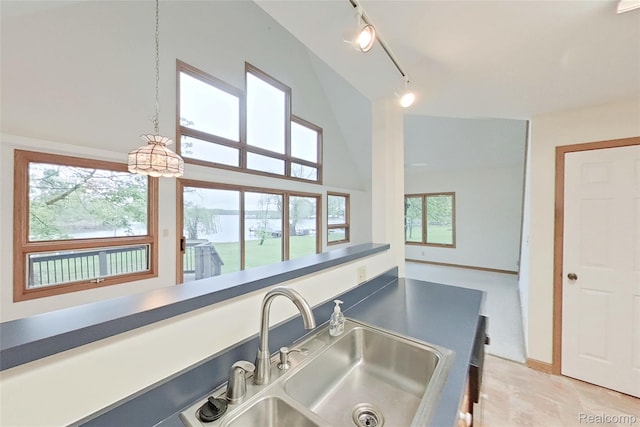8844 Riverside Dr, Brighton, MI 48116 - bathroom with a sink, a high ceiling, and rail lighting