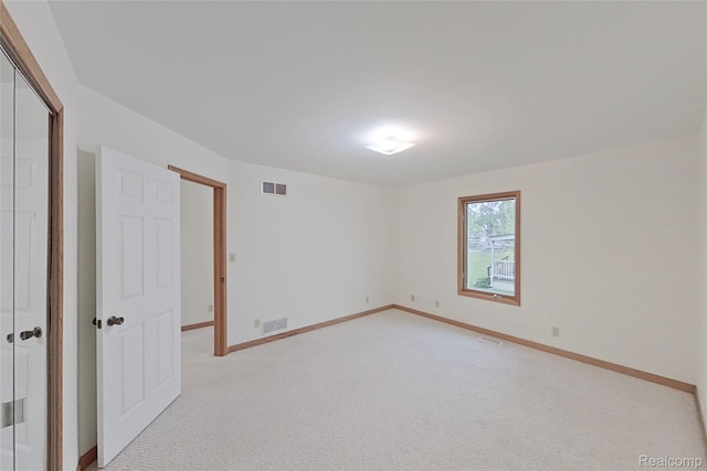 8844 Riverside Dr, Brighton, MI 48116 - unfurnished bedroom with a closet, light carpet, and baseboards