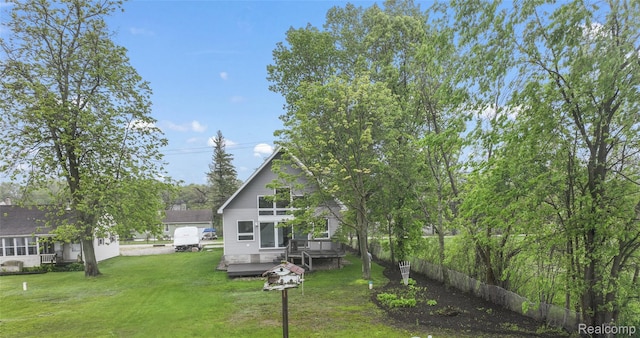 8844 Riverside Dr, Brighton, MI 48116 - back of property with a wooden deck