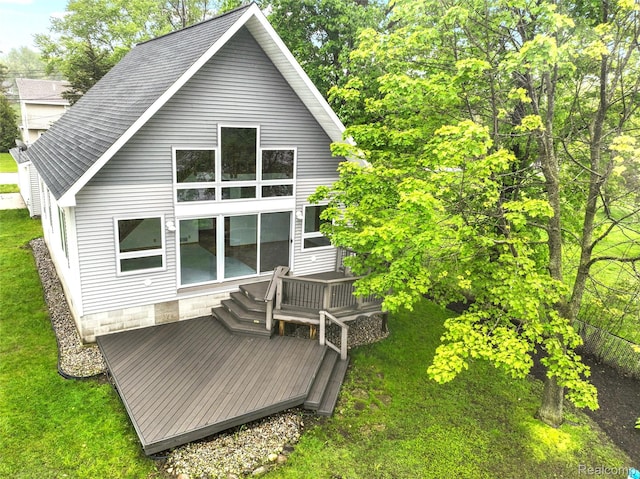 8844 Riverside Dr, Brighton, MI 48116 - rear view of property featuring a wooden deck and a lawn
