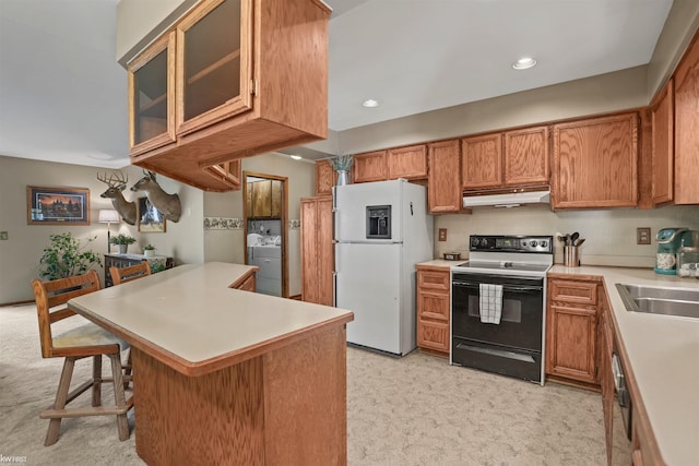 3641 Timber Ridge Dr, Metamora, MI 48455 - kitchen featuring electric stove, white fridge with ice dispenser, under cabinet range hood, light colored carpet, and a breakfast bar area