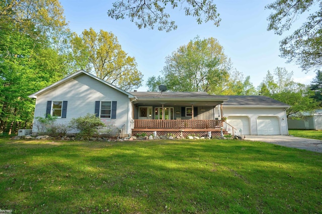 3641 Timber Ridge Dr, Metamora, MI 48455 - ranch-style house with covered porch, an attached garage, and a front lawn