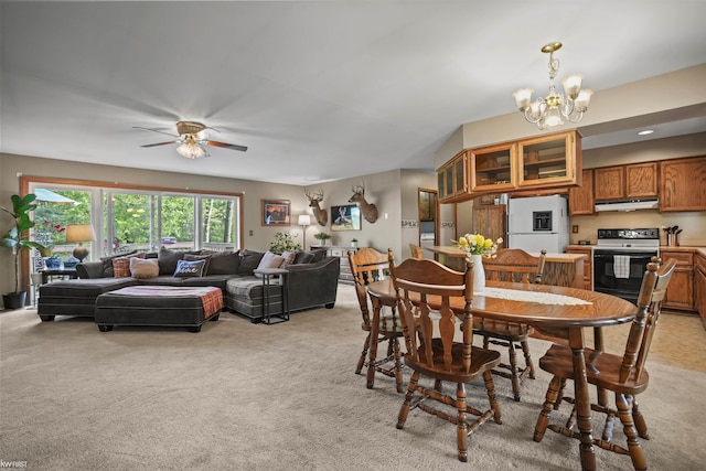3641 Timber Ridge Dr, Metamora, MI 48455 - dining room featuring light colored carpet, a chandelier, and a ceiling fan