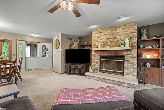 3641 Timber Ridge Dr, Metamora, MI 48455 - living room featuring carpet, ceiling fan, and a fireplace