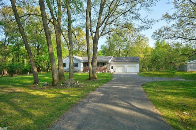 3641 Timber Ridge Dr, Metamora, MI 48455 - view of front of house featuring an attached garage, driveway, and a front yard